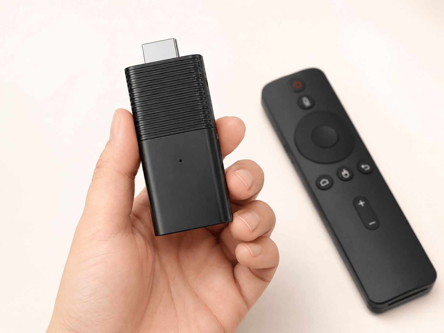 Hand holding a lightweight Flixy TV Stick to show size